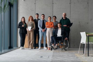 Multiethnic Business Team Collaborating in a Modern Office with Director in a Wheelchair. clipart