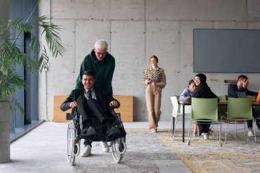 A diverse team of business colleagues, including a director in a wheelchair, engages in a collaborative discussion as they move together through a modern office space.  clipart