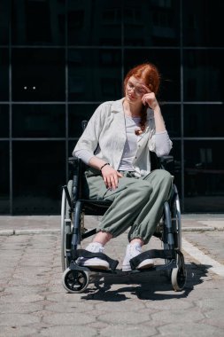 In front of a modern corporate building, a young woman sitting in a wheelchair confidently, symbolizing empowerment, inclusivity, and the strength to overcome challenges in the business world. clipart