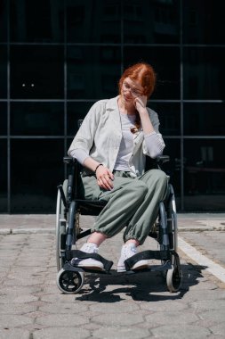 In front of a modern corporate building, a young woman sitting in a wheelchair confidently, symbolizing empowerment, inclusivity, and the strength to overcome challenges in the business world. clipart