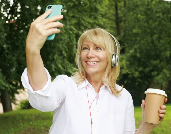 Charming Senior Blond Woman Holding Cup Coffee Making Selfie Summer — Fotografia de Stock
