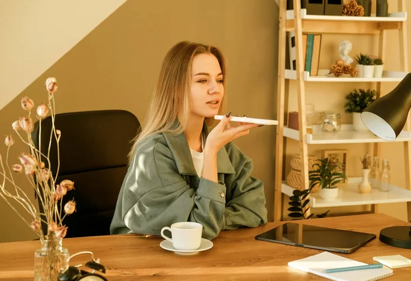 Young Woman Employee Sit Workplace Talk Speak Speakerphone Cellphone Millennial —  Fotos de Stock