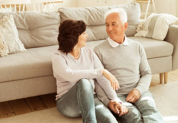 Elderly Couple Hugging While Sitting Floor Living Room Relationship Old — Stockfoto