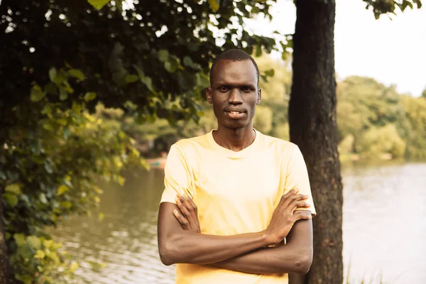 Portrait Young African Man Who Stands His Arms Crossed Summer — стоковое фото