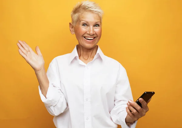 Attractive Elderly Woman Wearing White Shirt Pixie Blonde Hair Presents — Stock Photo, Image