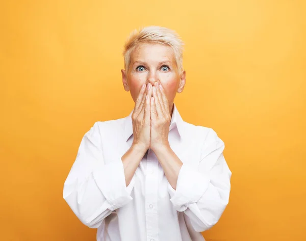 Senior Grey Haired Woman White Blouse Covering Her Mouth Palms — Stock Photo, Image