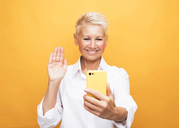 Mature Attractive Woman Short Hair Taking Selfie Yellow Background — Stock Photo, Image