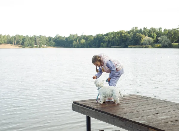 Seven Year Old Girl Small White Dog Stands Bridge Lake — Photo
