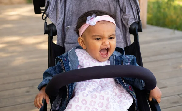 Pretty Baby Girl Sits Stroller Laughs Loudly Lifestyle Childhood Concept — Stock Photo, Image