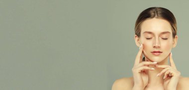 Photo of joyful lady touch hands cheeks complexion enjoy aesthetic ideal perfect skin isolated over grey color background