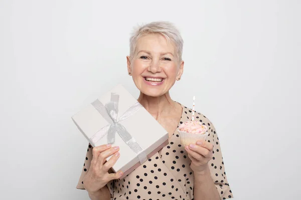 Charming Pensioner Woman Short Haircut Holding Gift Cupcake Candle Celebrating — Stock Photo, Image