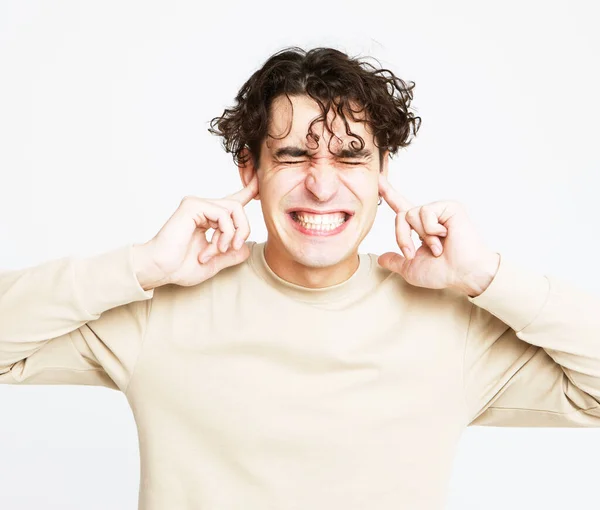 Young Handsome Brunette Man Hold Hands Temples Ears Screams Emotion — Stock Photo, Image