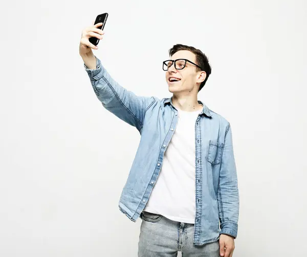 Portrait Young Handsome Man Taking Selfie Holding Phone White Background Royalty Free Stock Images