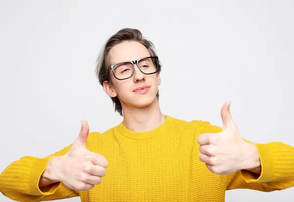 Young Man Wearing Yellow Sweater Showing White Background Stock Image