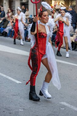 Palamos, Spain - february 19, 2023, Traditional carnival parade in a small town Palamos, in Catalonia, in Spain
