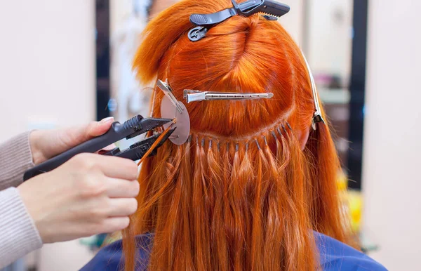 Hairdresser Does Hair Extensions Young Red Haired Girl Beauty Salon — Stock Photo, Image