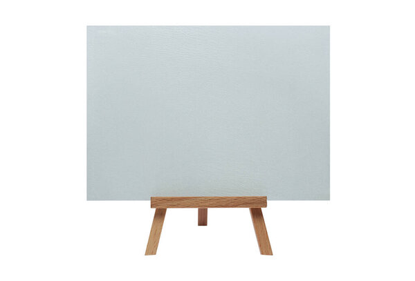 Clean canvas on an easel on an isolated white background.