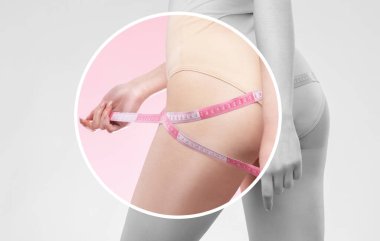 İnce bir kız, belini ve kalçasını pembe arka planda bir santimetre ile ölçer. Kilo kaybı ve sağlıklı yaşam tarzı kavramı.