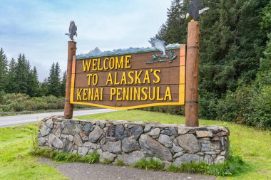 Seward, AK - September 1, 2022: Welcome to Alaska's Kenai Peninsula sign along the highway leading to Seward clipart