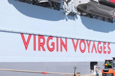 IJmuiden, The Netherlands - April 20th, 2022:  Valiant Lady cruise ship, detail of the hull with company name Virgin Voyages