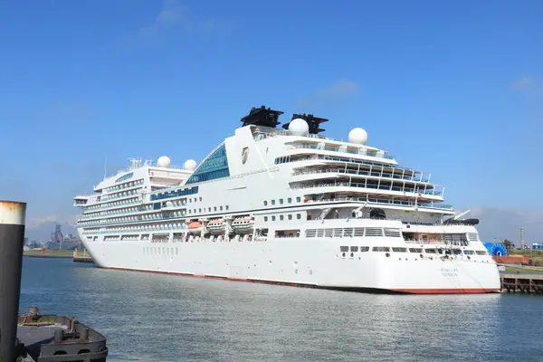 stock image IJmuiden, The Netherlands - July 17th 2020: Seabourn Ovation, moored at Felison Terminal for foraging and maintenance. Out of use due to worldwide Covid 19 pandemic that suspended all cruises