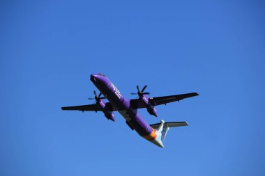 Amsterdam the Netherlands - May 3rd 2018: G-PRPE Flybe De Havilland Canada DHC-8-400 takeoff from Polderbaan runway, Amsterdam Airport Schiphol clipart