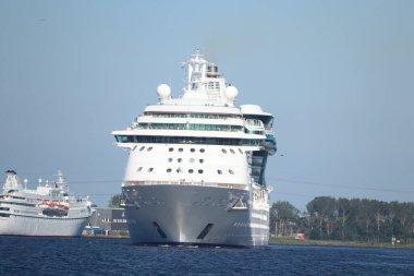 IJmuiden, the Netherlands - June 23rd, 2024: Jewel of the Seas, operated by Royal Caribbean on North Sea Canal towards Zeesluis IJmuiden, biggest sea lock in the world. clipart