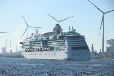 IJmuiden, the Netherlands - June 23rd, 2024: Jewel of the Seas, operated by Royal Caribbean on North Sea Canal towards Zeesluis IJmuiden, biggest sea lock in the world. clipart