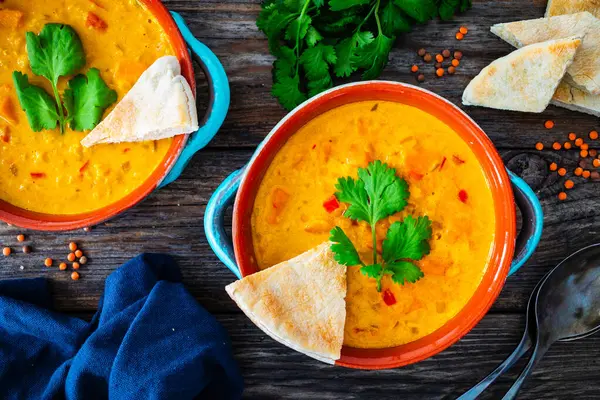Dal soup - Indian delicious lentil soup on wooden background