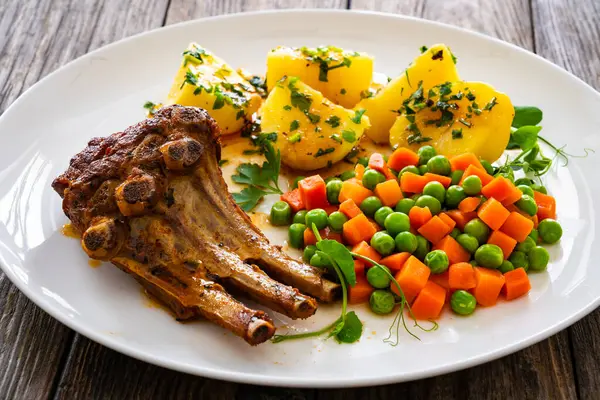 Veal Ribs Boiled Potatoes Peas Carrots Wooden Table — Stock Photo, Image
