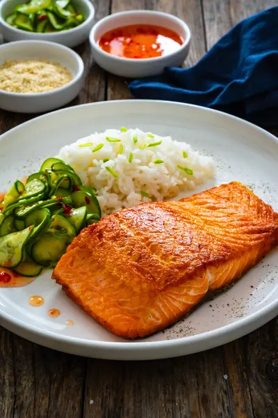 Seared Salmon Steak Boiled White Rice Sliced Cucumber Wooden Table — Stock Photo, Image