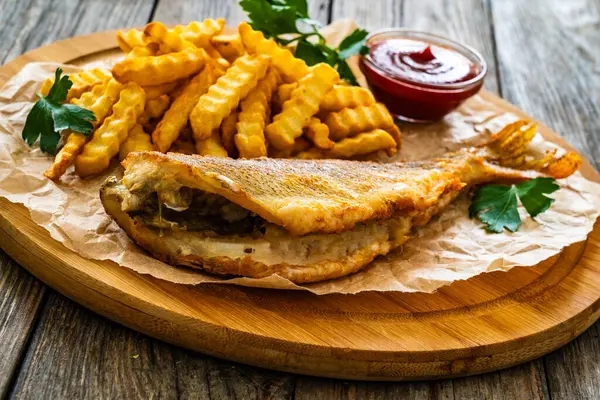 Fried Sea Bass Served Paper French Fries Ketchup Board Wooden Stock Picture
