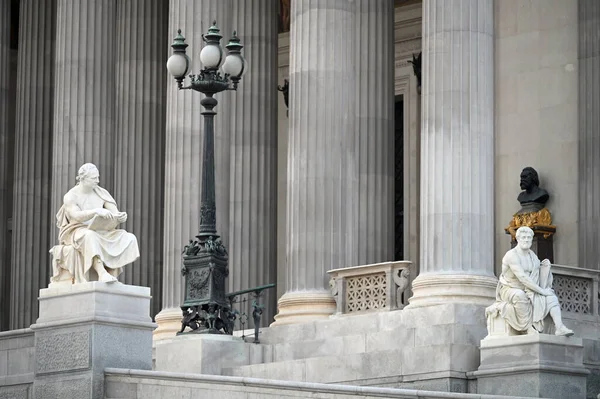 stock image Two statues in front of the Austrian parliament in Vienna Austria