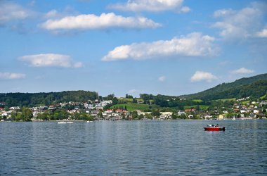 Lake Traun Traunsee and houses on hills in Gmunden Upper Austria  clipart