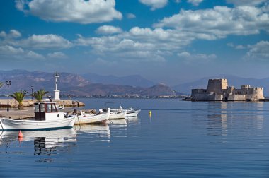 Bourtzi water fortress and port with boats in Nafplio, Peloponnese, Greece clipart