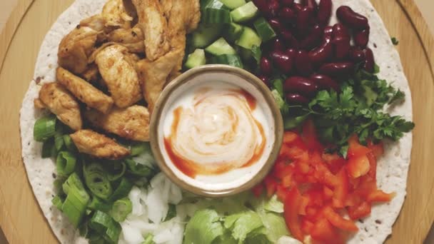 Fresh Ingredients Preparing Tortilla Vegetables Grilled Chicken Sauce Flat Lay — Stock Video