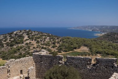 Ruins of Kritinia Castle at the shore of Mediterranean Sea at Rhodes Island