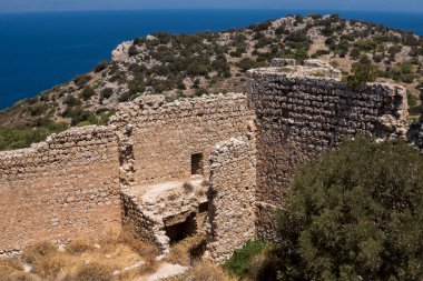 Ruins of Kritinia Castle at the shore of Mediterranean Sea at Rhodes Island