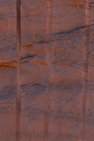 stock image Close-up of red sandstone from the quarry with traces of drilled holes