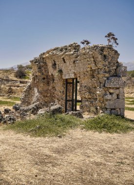 Landscape with ruins of Ancient Roman city Aptera on the island of Crete in Greece clipart