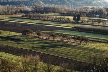 nostalgic autumn landscape with empty fields in the vistula valley clipart