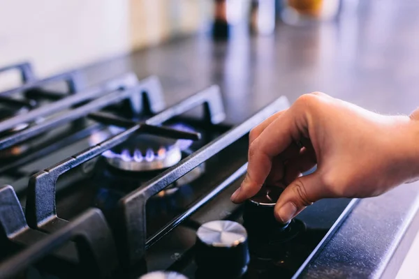 Hand Turning Gas Burner Kitchen Stove Top — Stock Photo, Image