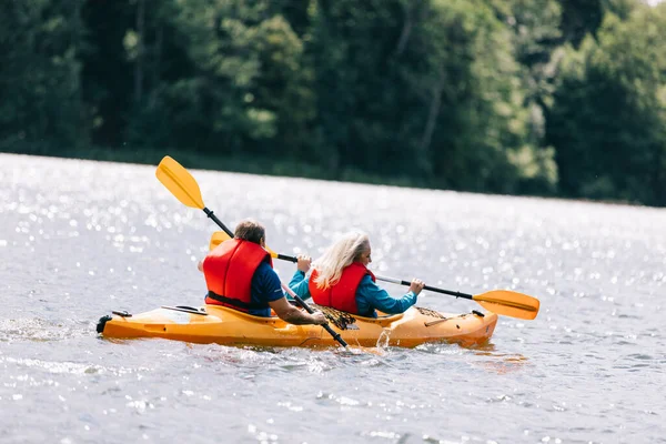 Happy Senior Active Couple Kayaking Lake Enjoying Time Together — Stock Photo, Image