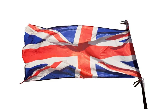 イギリスの国旗が風を吹いている 透明な白い背景で切り取られ 隔離される ユニオン ジャックの旗 ロイヤリティフリーのストック画像