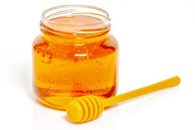 beyaz zemin üzerine bal ile jar