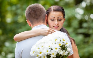 Happy young couple in love outdoors in park