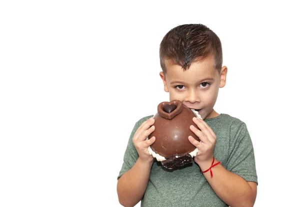 stock image happy little boy with easter chocolate egg on light background