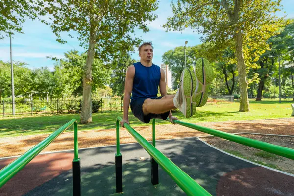 Young Guy Athlete Exercising Sports Equipment Park Stock Photo