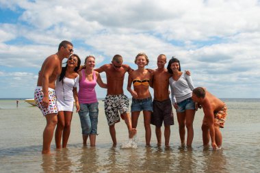 Groups of young people going to sea. clipart