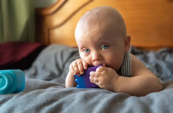 stock image Portrait of a happy baby boy on the bed.